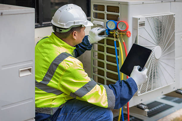 Professional Emergency Hvac Repair technician working in Hampton, NY